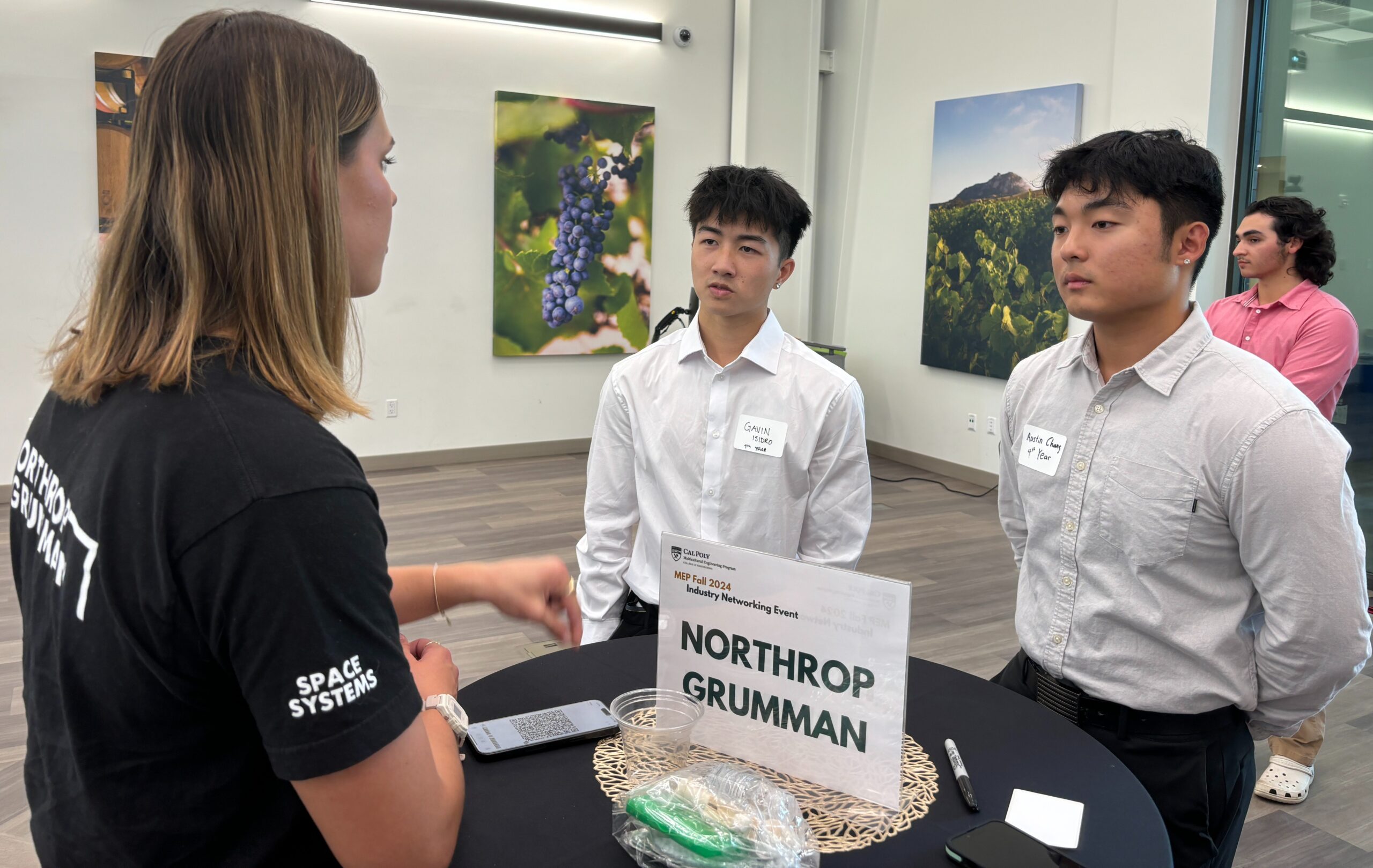 Students chat with industry professional during networking event