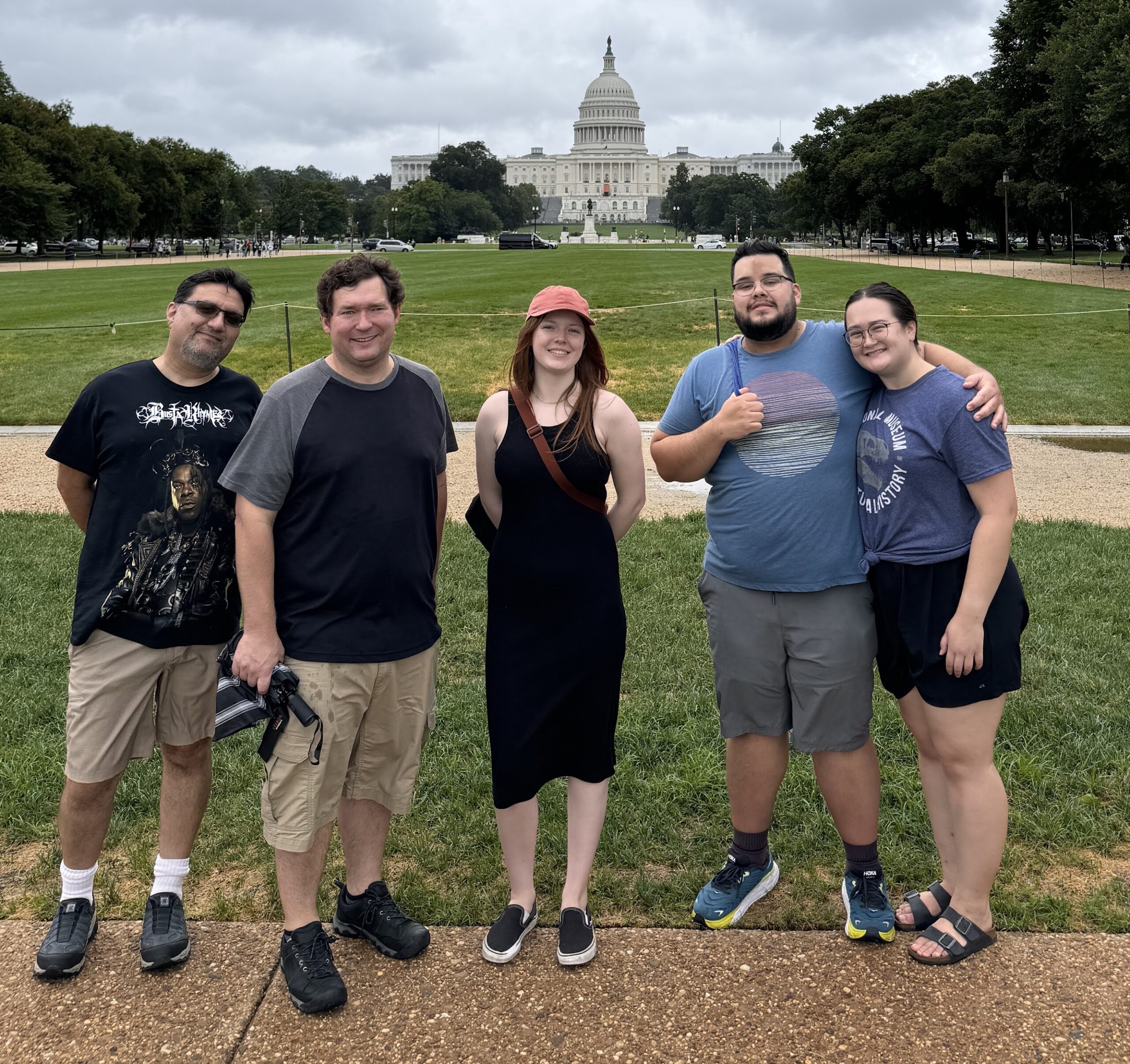 Group stands in front of the Capitol