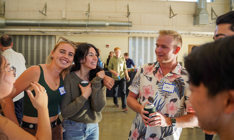 A group of people smiling and laughing.