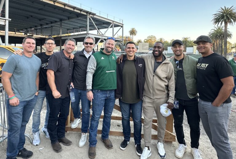 Group of donors and alum gather at the football stadium