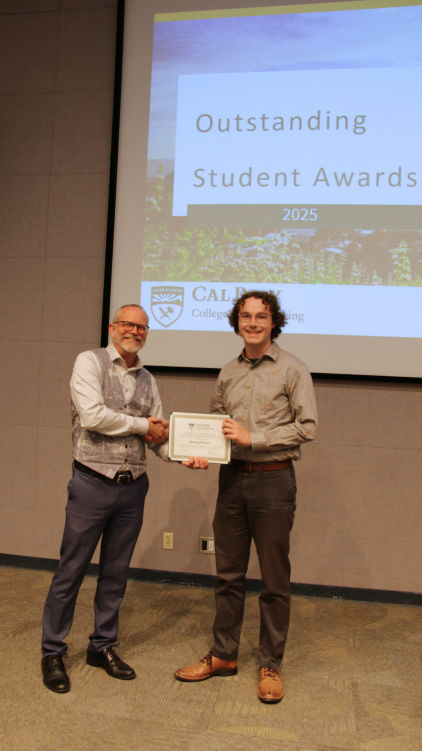 A student receiving an award