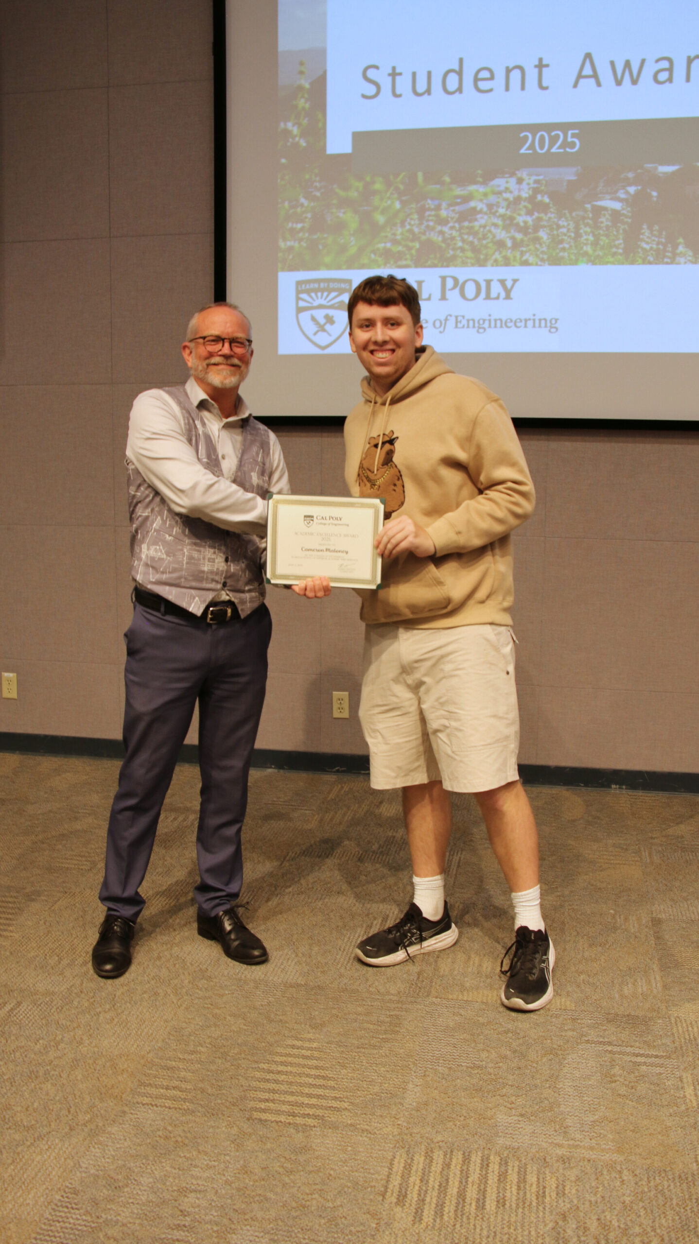 A student receiving an award