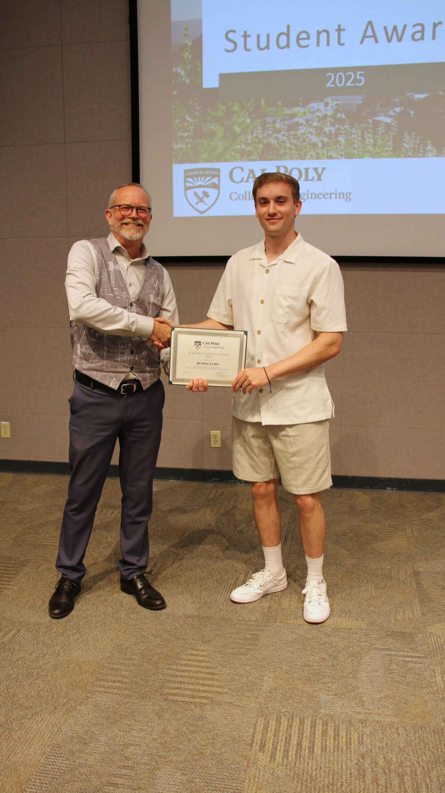 A student receiving an award