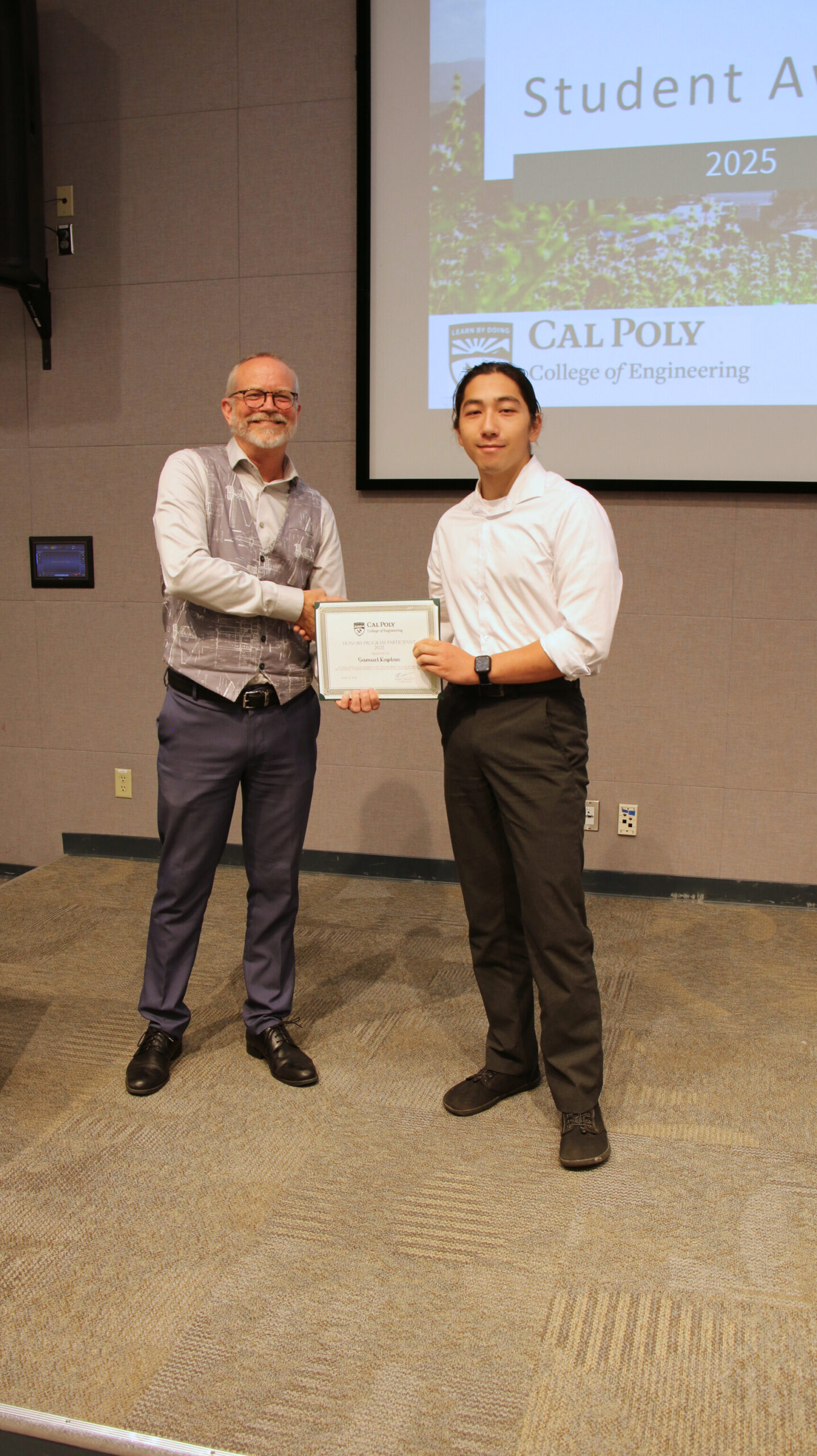 A student receiving an award