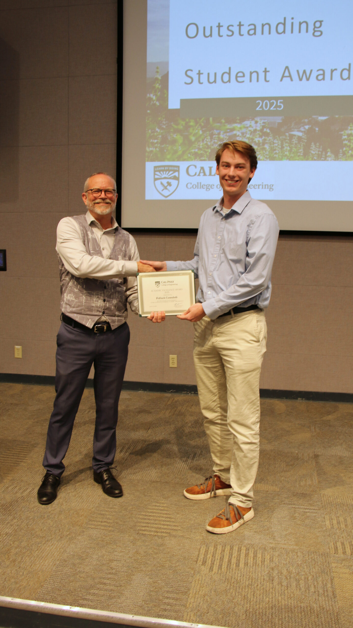A student receiving an award