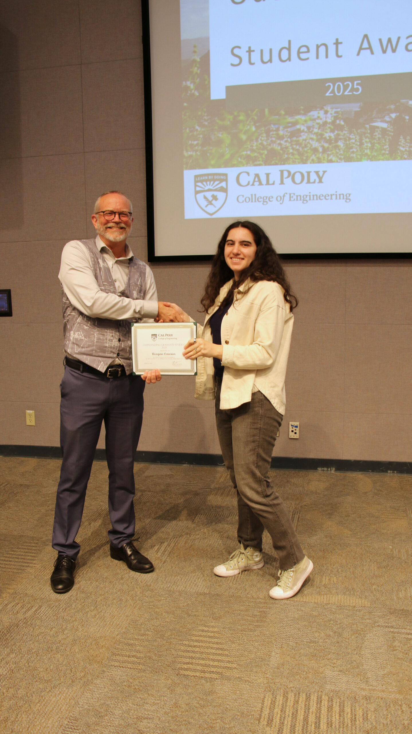 A student receiving an award
