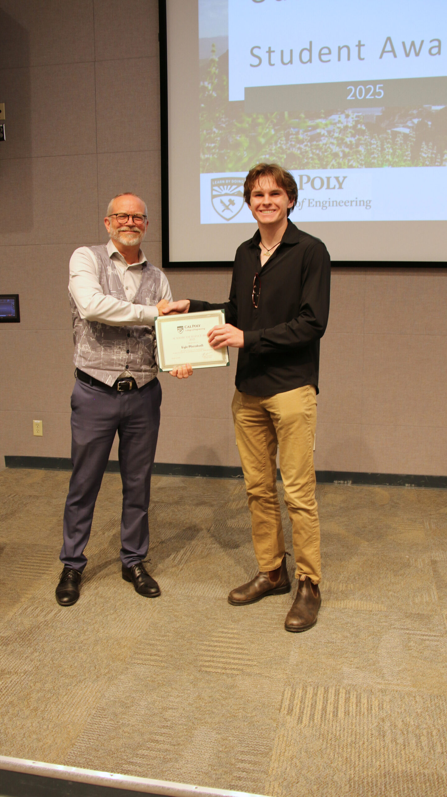 A student receiving an award