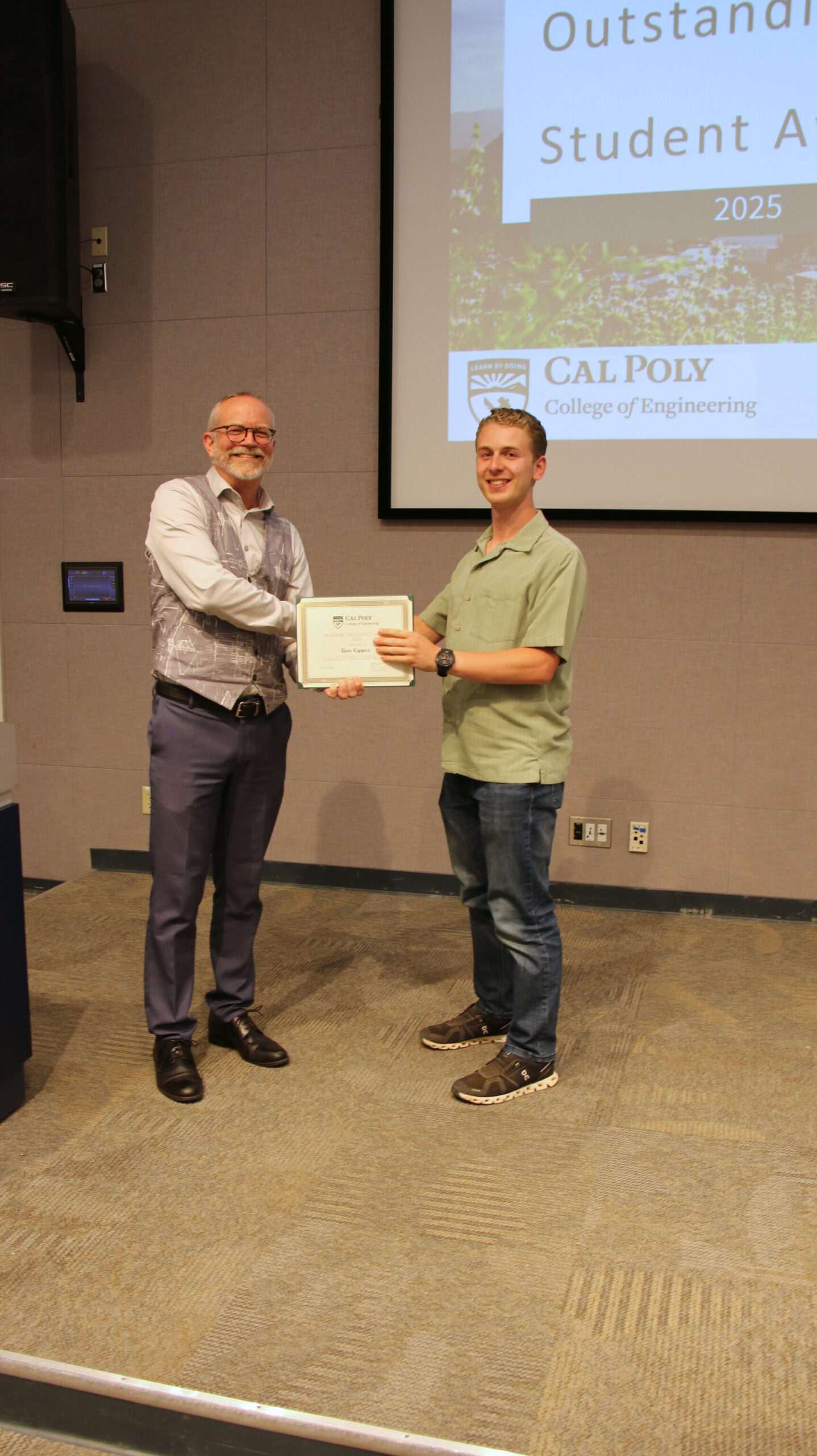 A student receiving an award