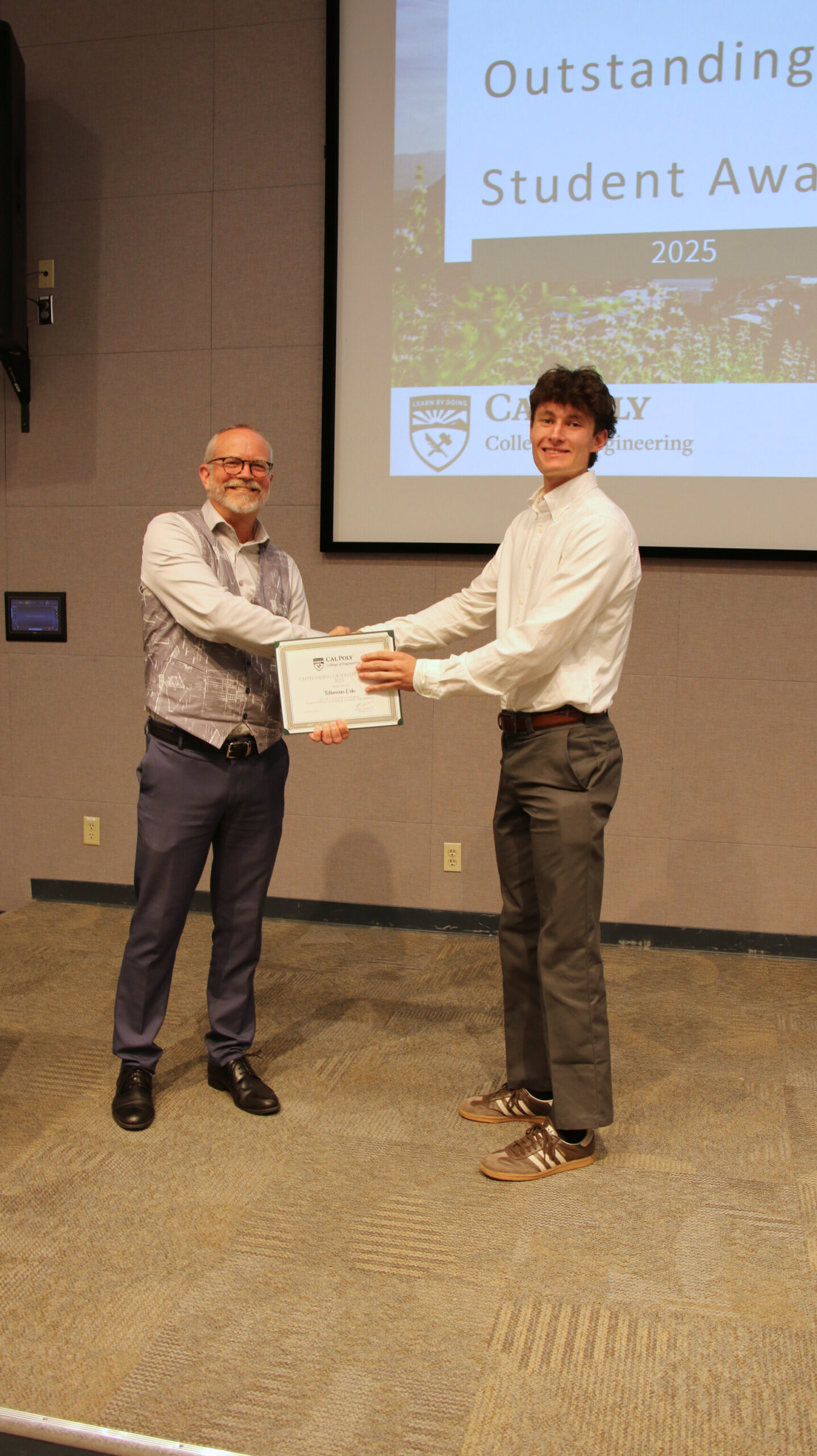 A student receiving an award