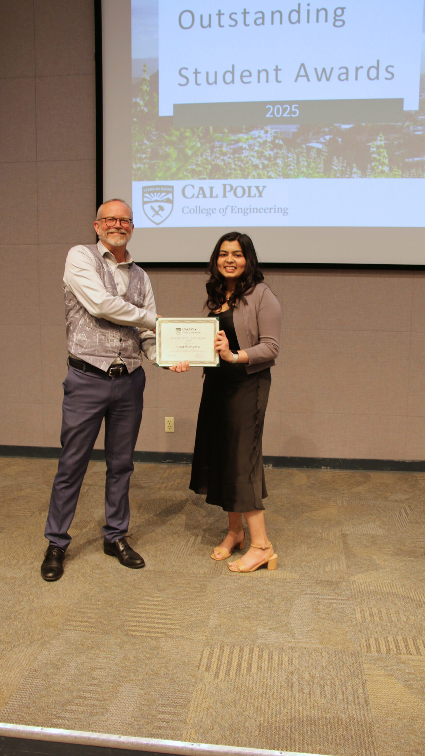 A student receiving an award