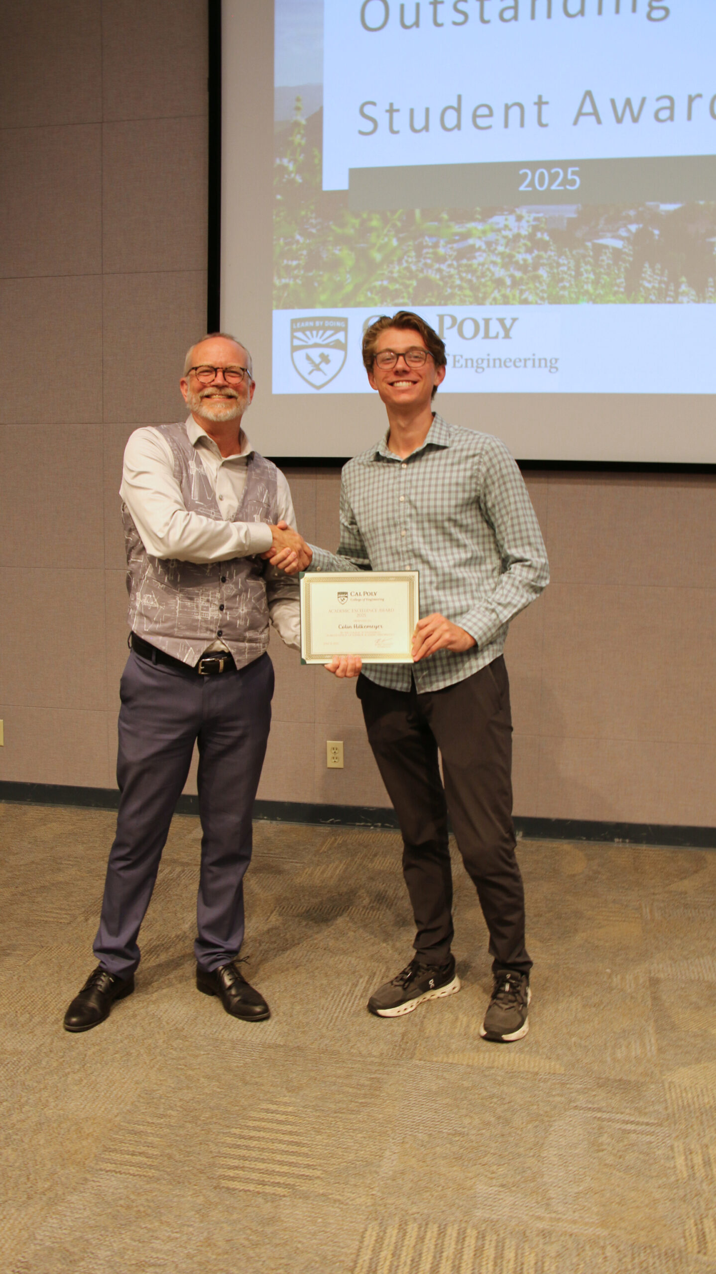 A student receiving an award