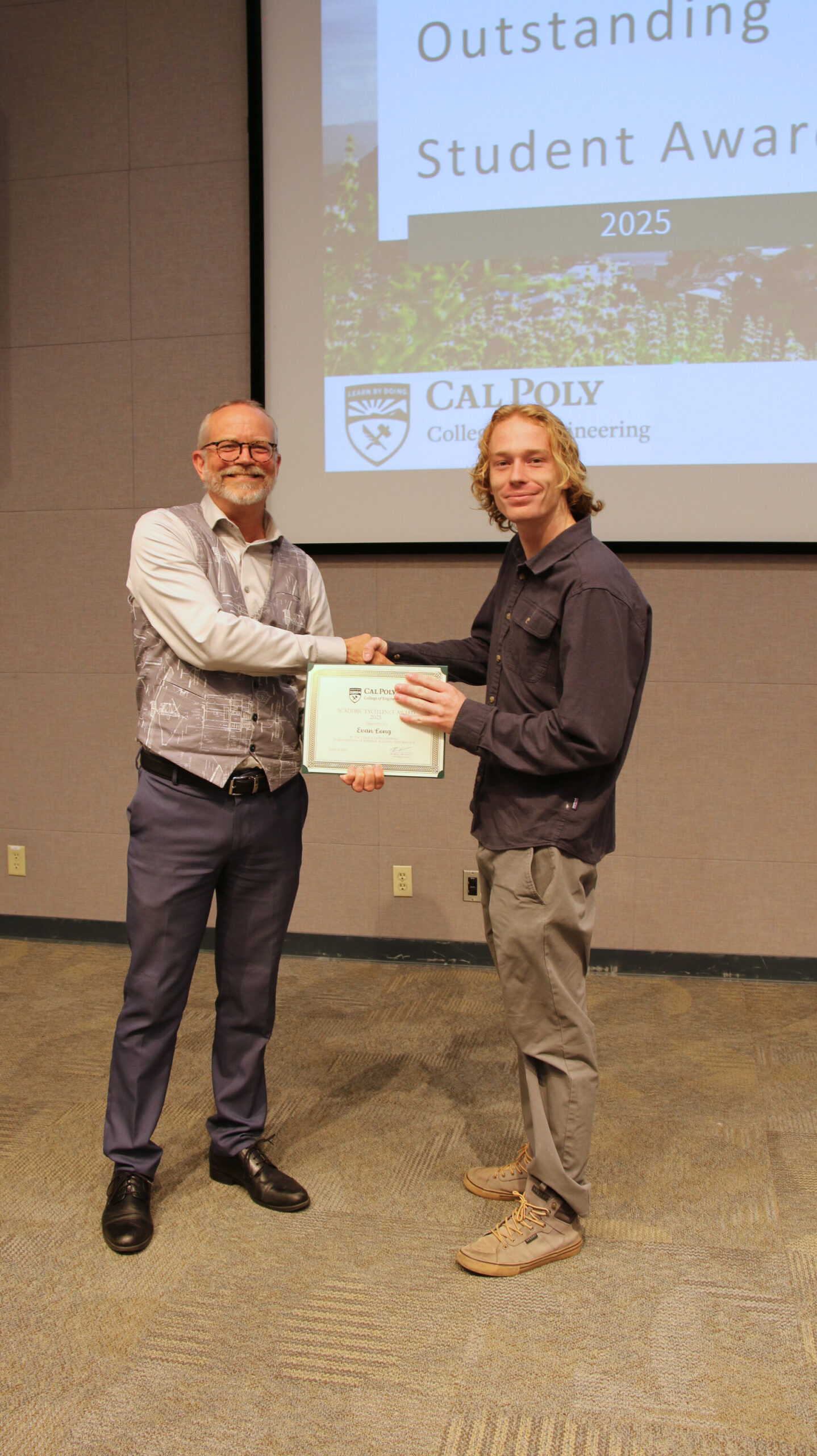 A student receiving an award