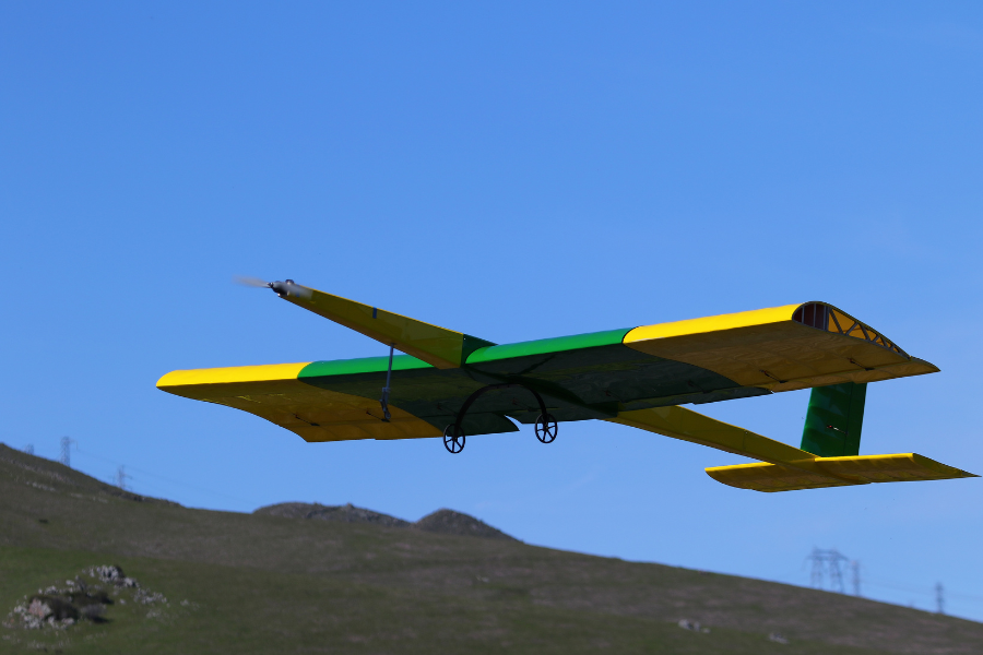 A student-made plane in the air.