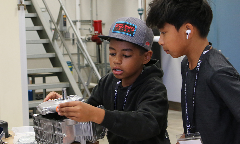Students disassemble an engine