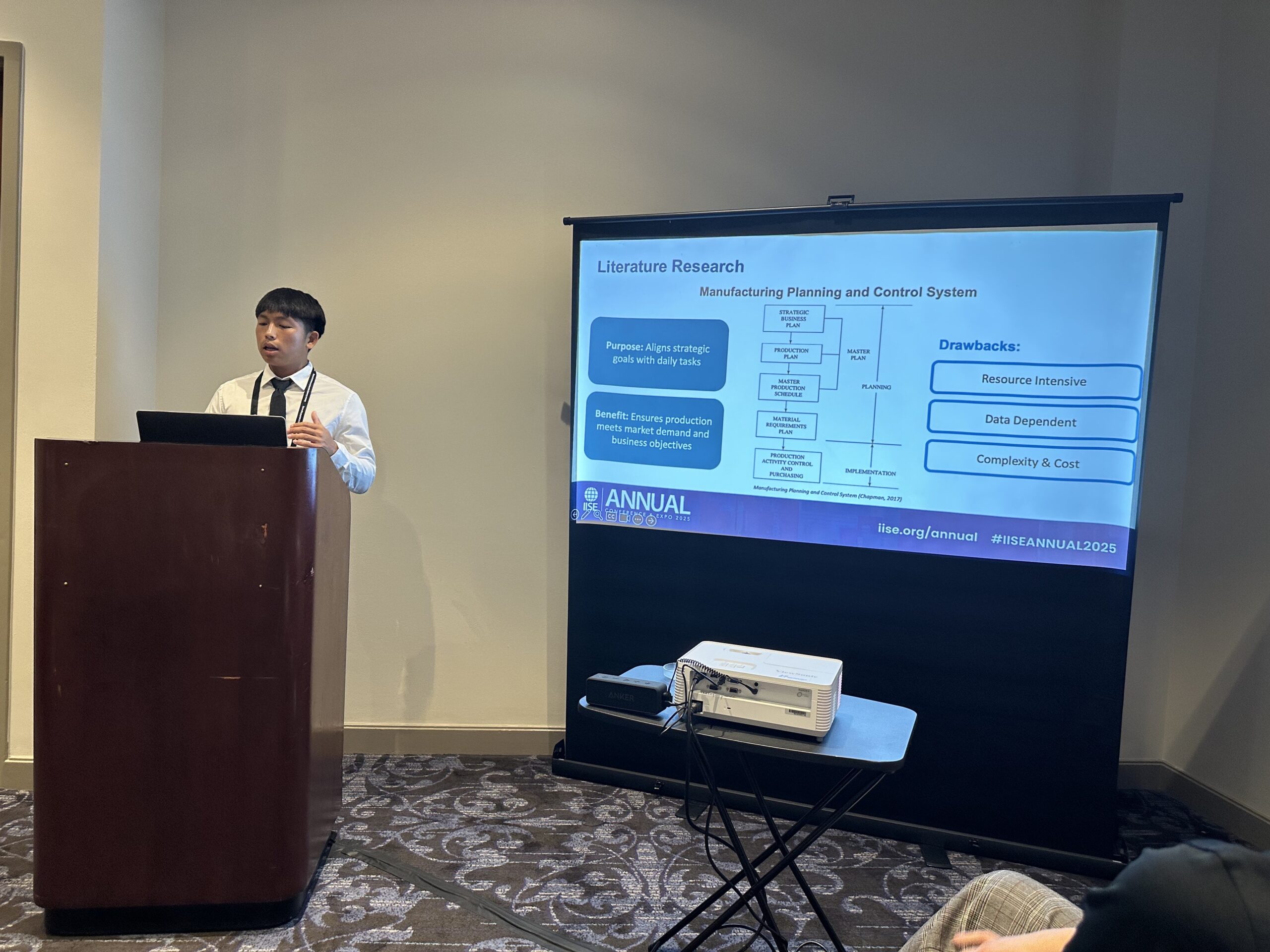 A student at a podium giving a presentation.
