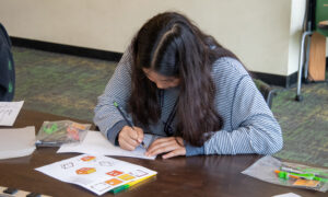 student sketching dream home