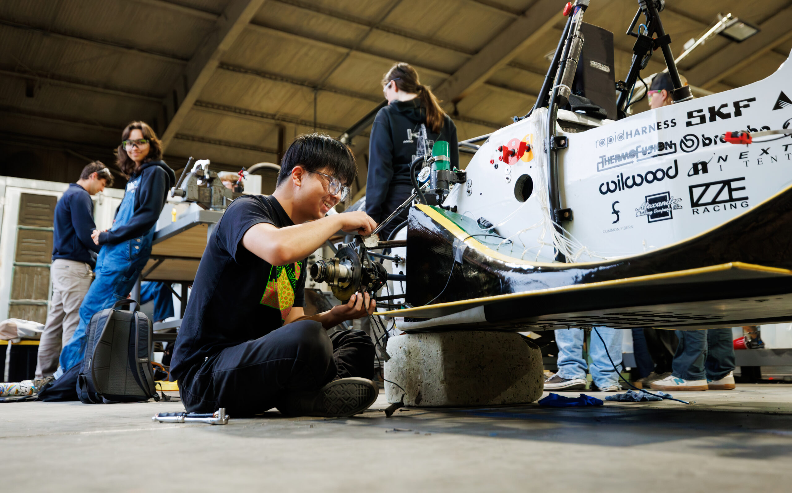 Students work on Cal Poly Racing vehicles in the machine shop