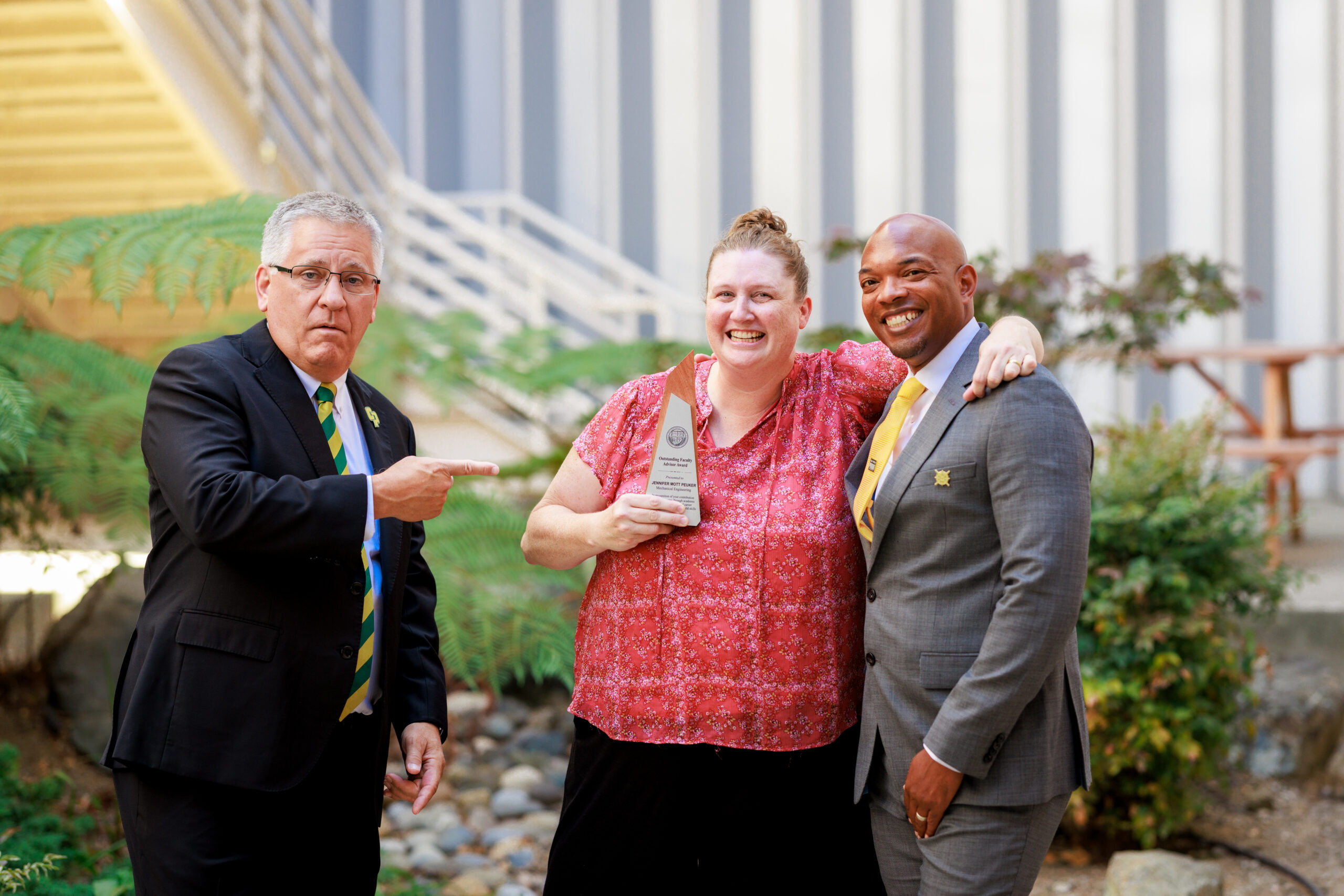 Professor celebrates with leadership after being named an honoree
