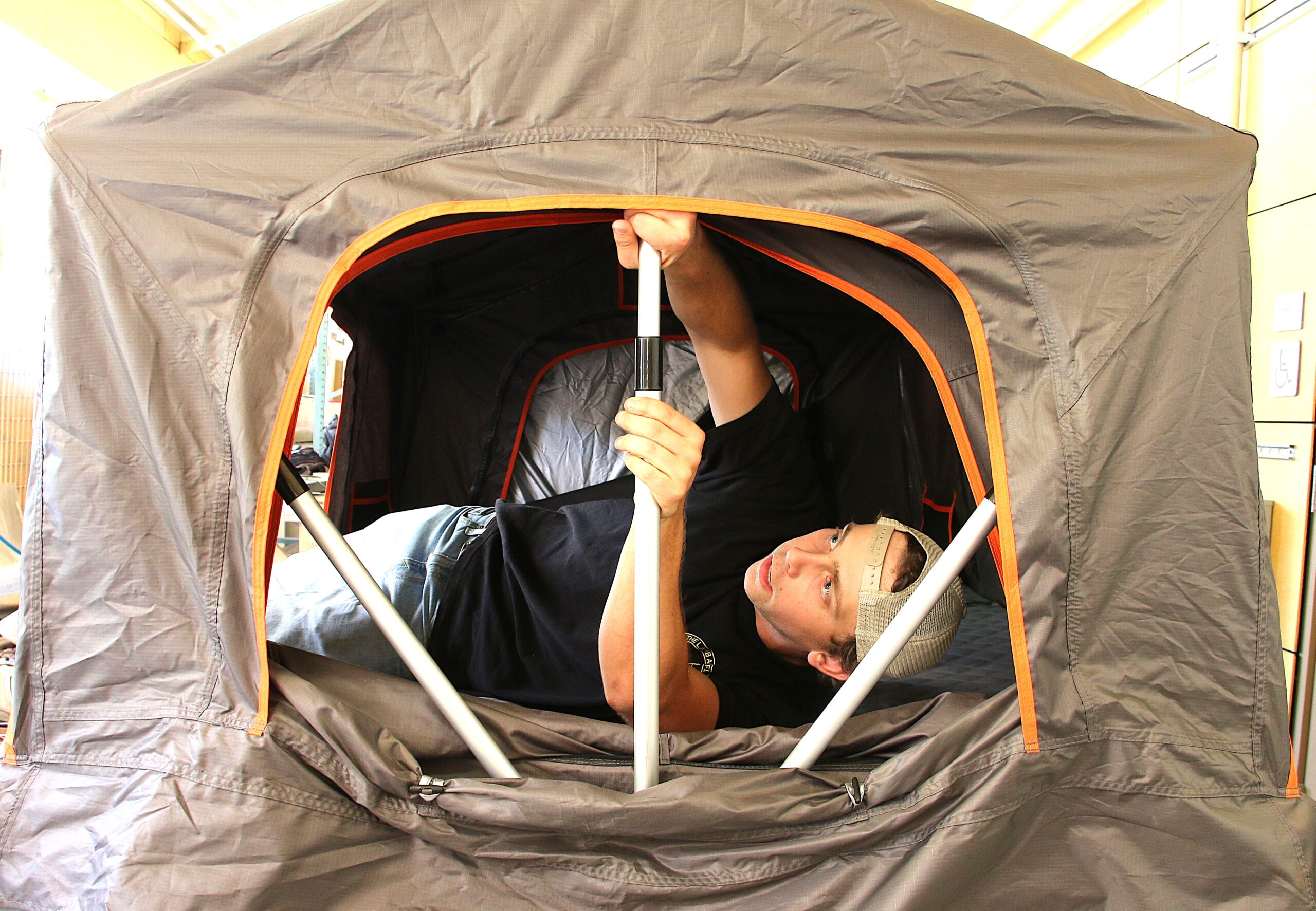 Student adjusts the frame of a micromobile home