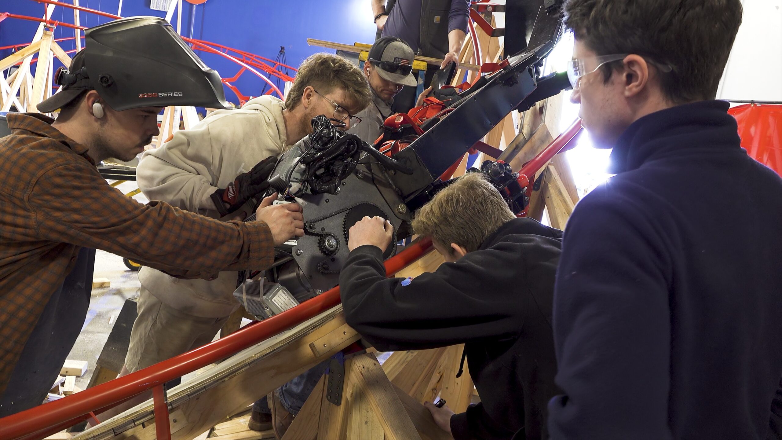 Group works on roller coaster