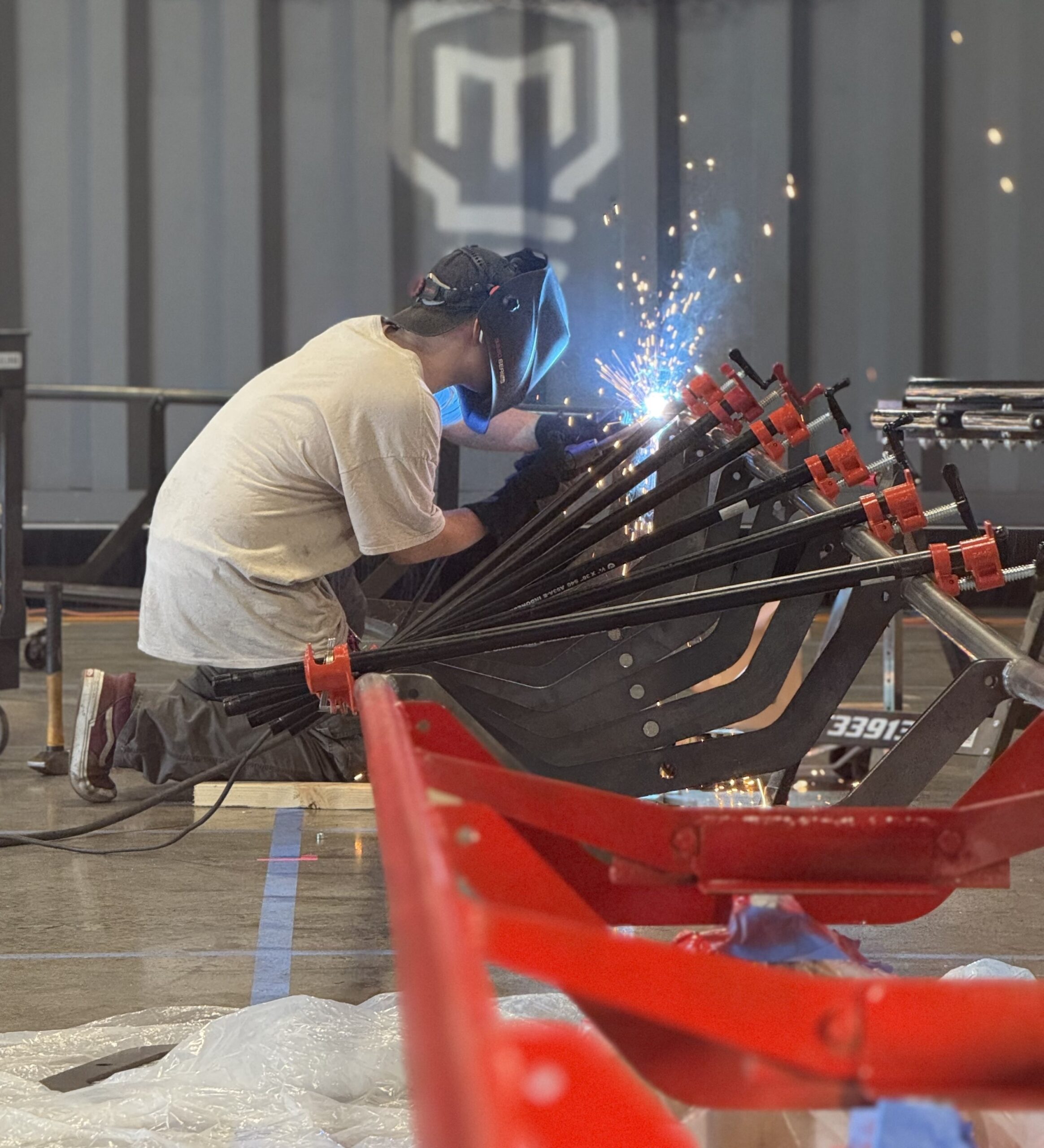 Man welds roller coaster track