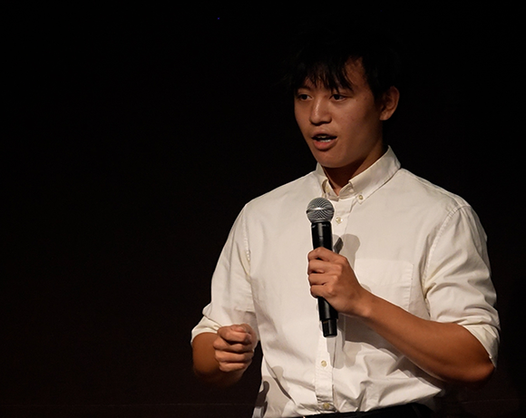 Student presenting on stage