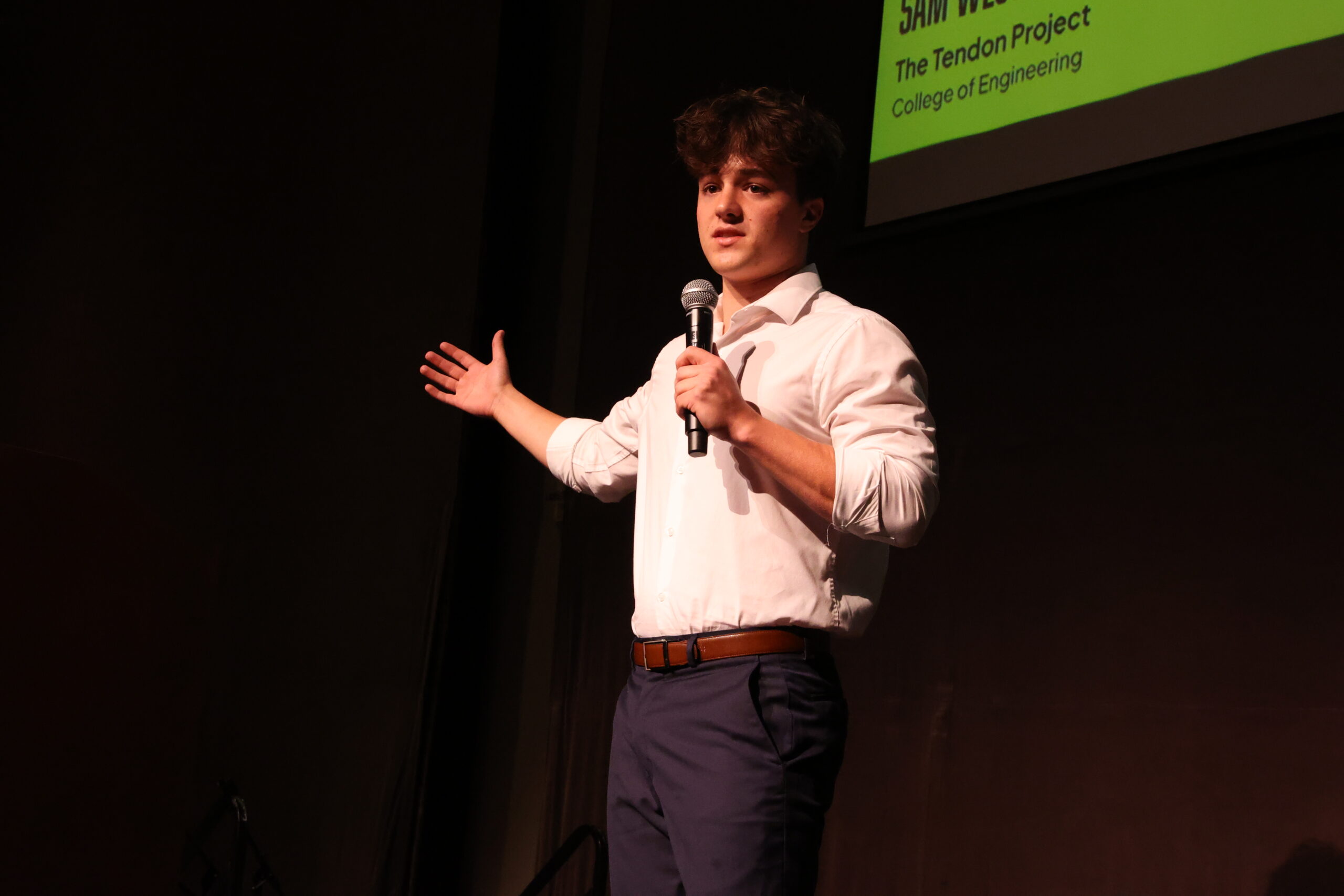 Student presenting on stage