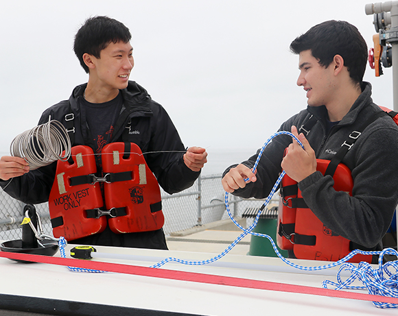 students work with titanium coil artificial reef