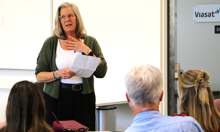 Professor speaks at a reception