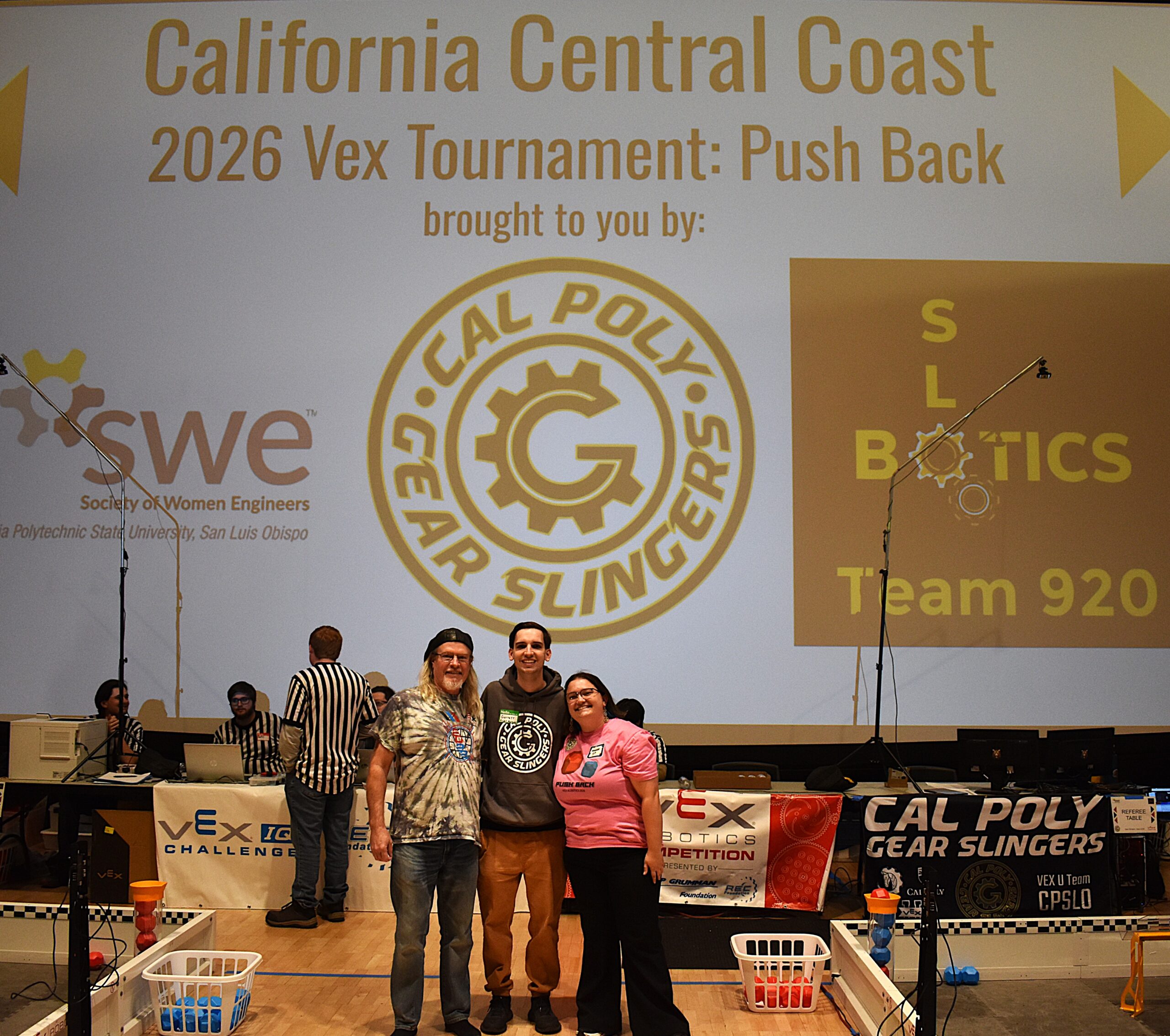 Robotics tournament organizers pose in Chumash Auditorium