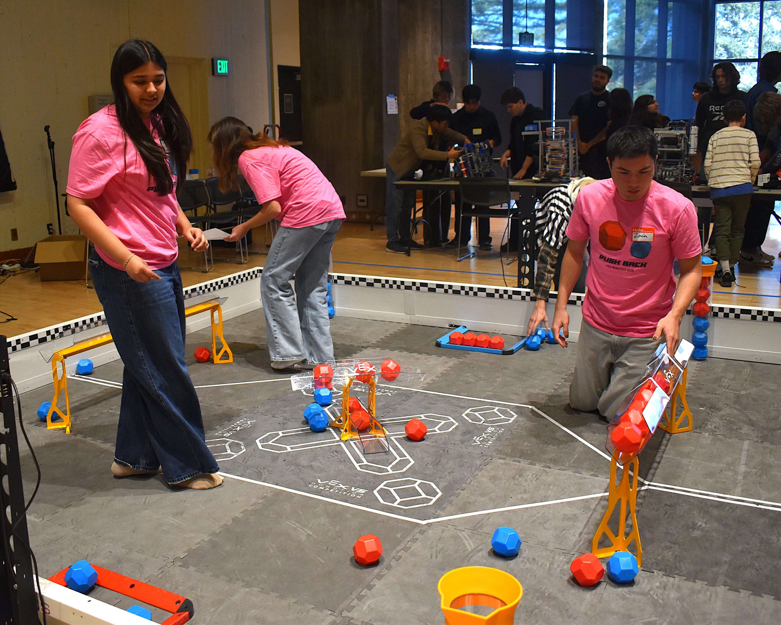 Volunteers set up the field during competition