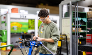 A student fixing a bike