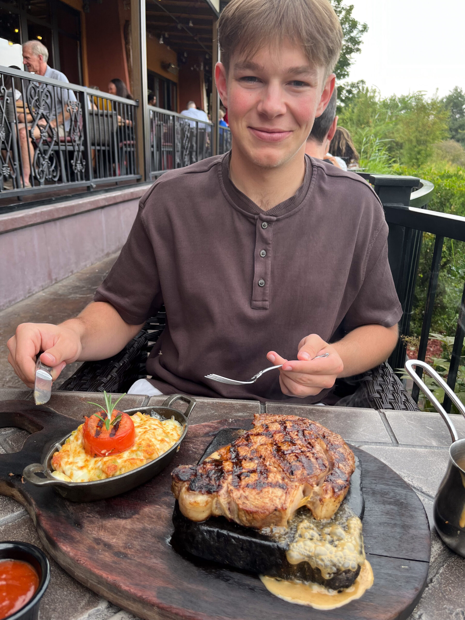 Carter eating a meal at a restaurant