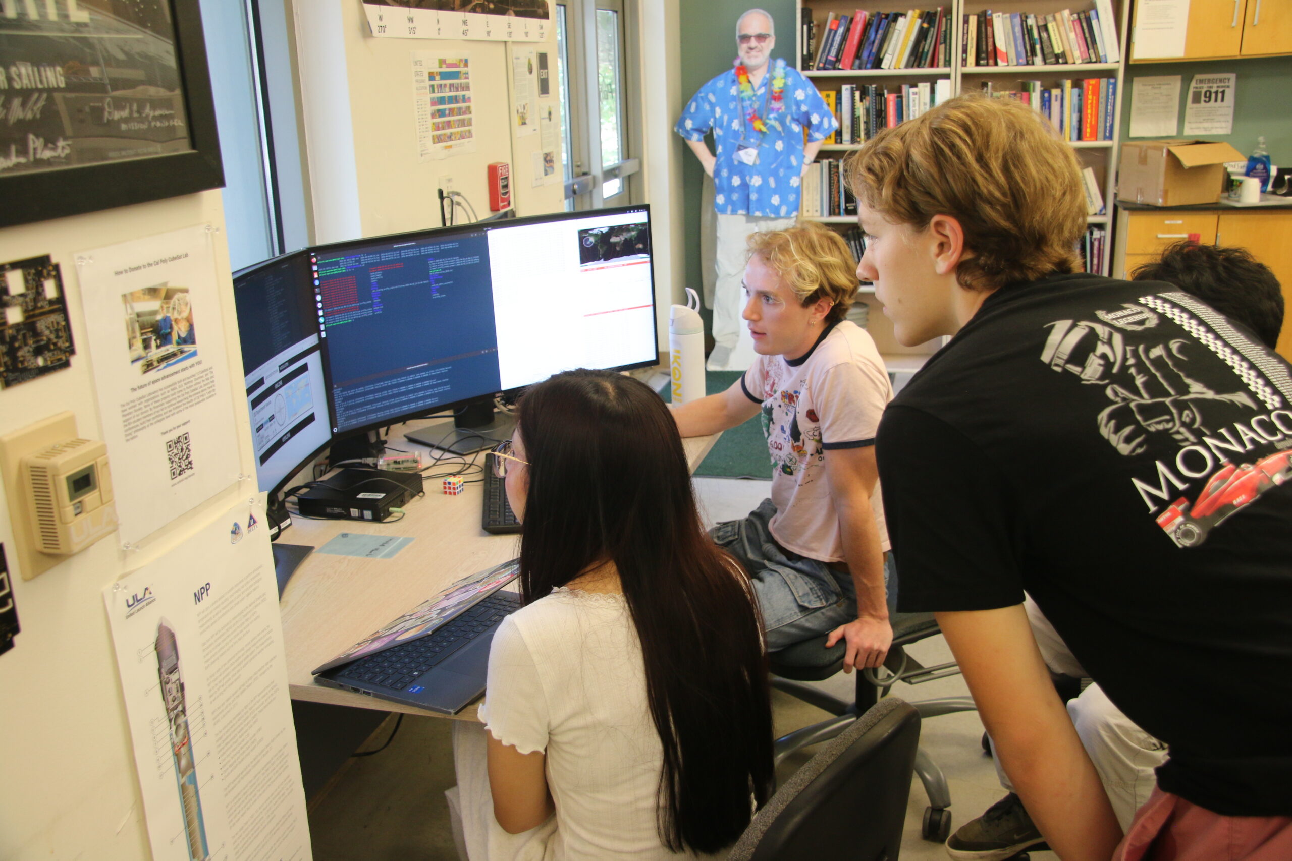 Students monitor a ground pass on computer monitors